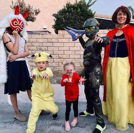 Kirsten Heder with her four kids cosplaying some characters of Disney movies.